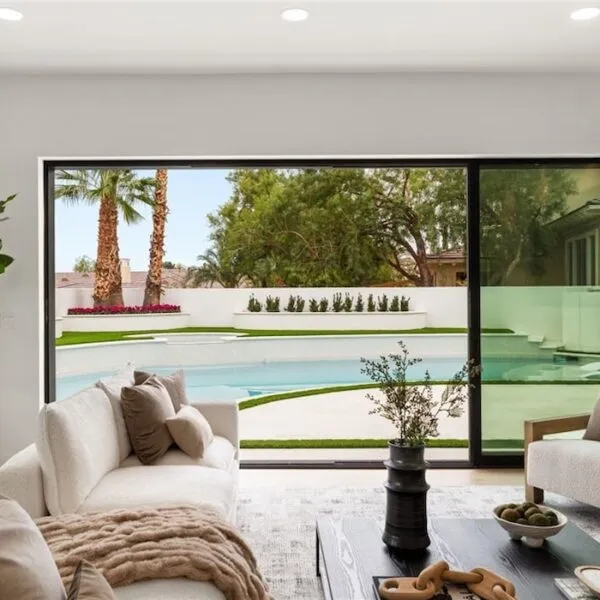 image of stunning image of living room with glass door going to swimming pool