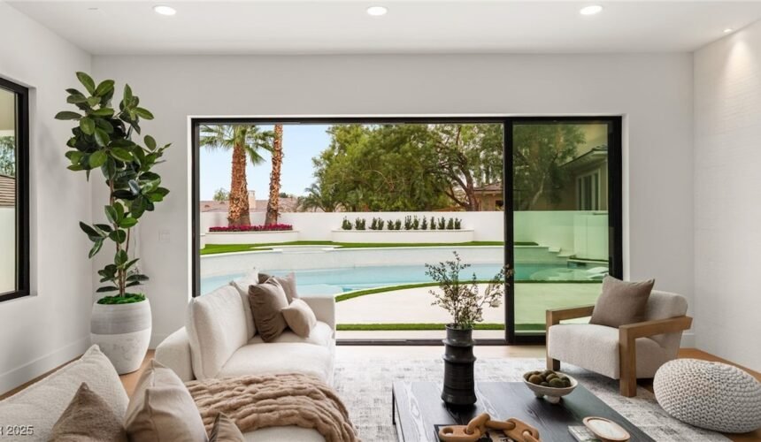 image of stunning image of living room with glass door going to swimming pool