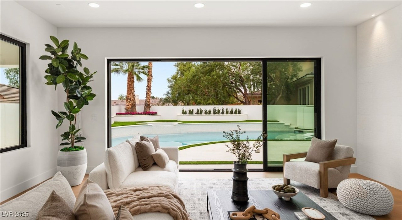 image of stunning image of living room with glass door going to swimming pool