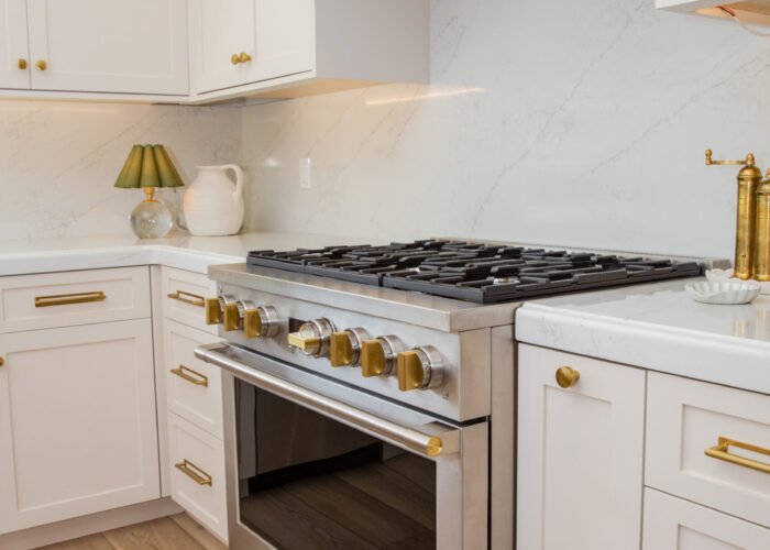 image of stove and cabinets in kitchen